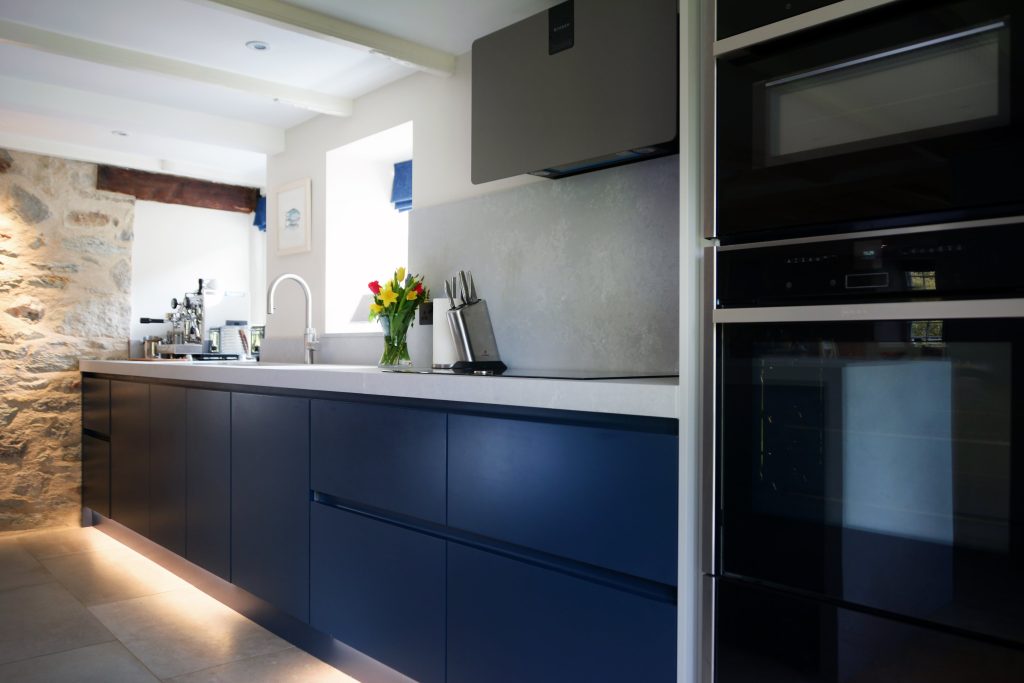 Blue handleless kitchen in Truro